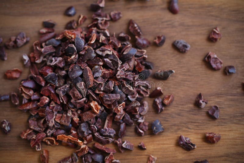 Cacao or cocoa raw beans, crushed. To nibs, superfood royalty free stock photography