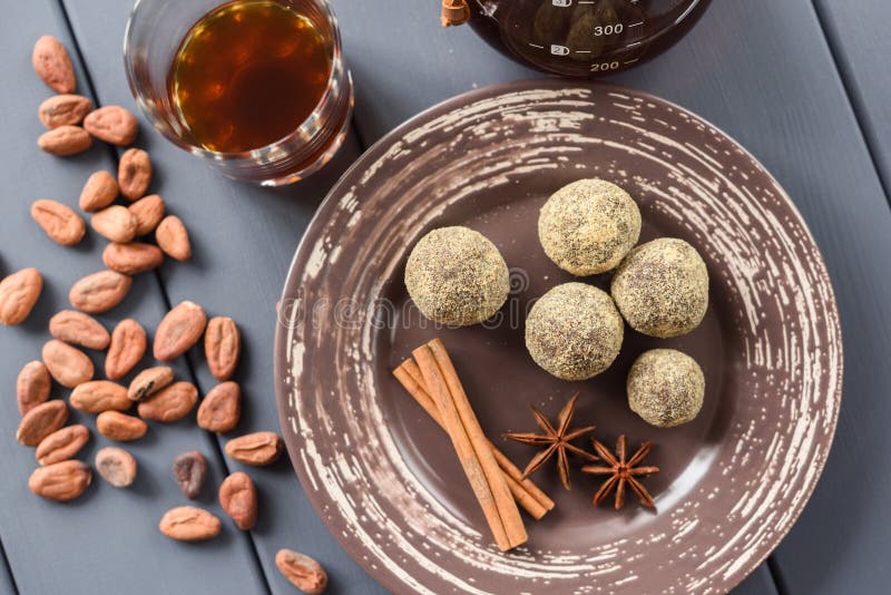 Healthy chocolate bonbons with spices, raw cocoa beans and coffee. Overhead view royalty free stock photo