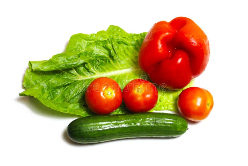 Lettuce, Tomatoes, Cucumber, Red Bell Pepper. Organic fresh vegetables. Composition: Health and Diet. White background. Lettuce, Tomatoes, Cucumber, Red Bell royalty free stock photography